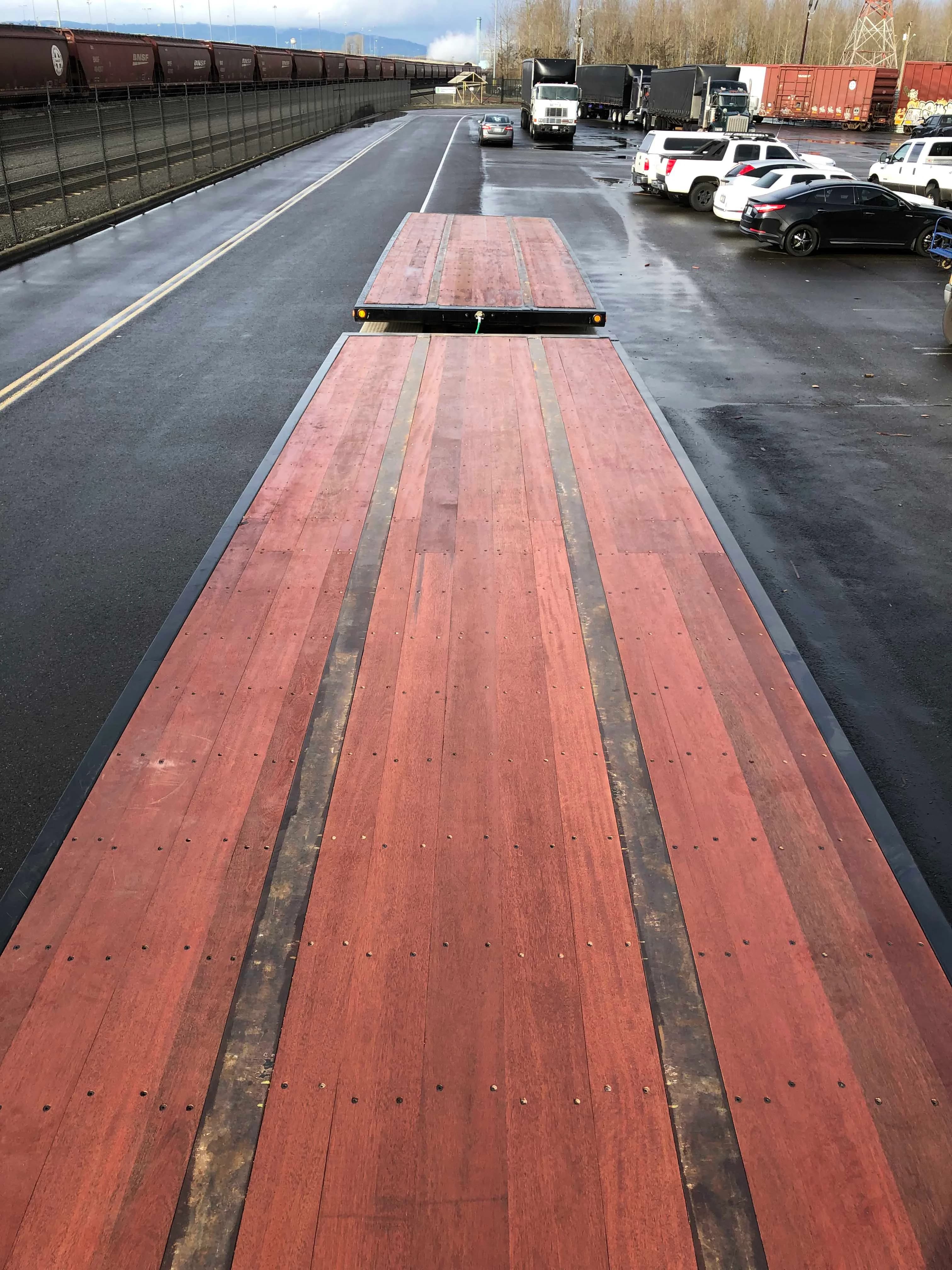 Apitong B-train trailer deck finished with Apitong Oil — deep amber color