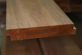 Heavy-duty rough-sawn tropical hardwood trailer flooring boards stacked for shipment