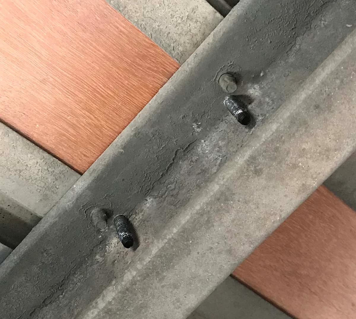 Marking new screw locations on a trailer cross member from above