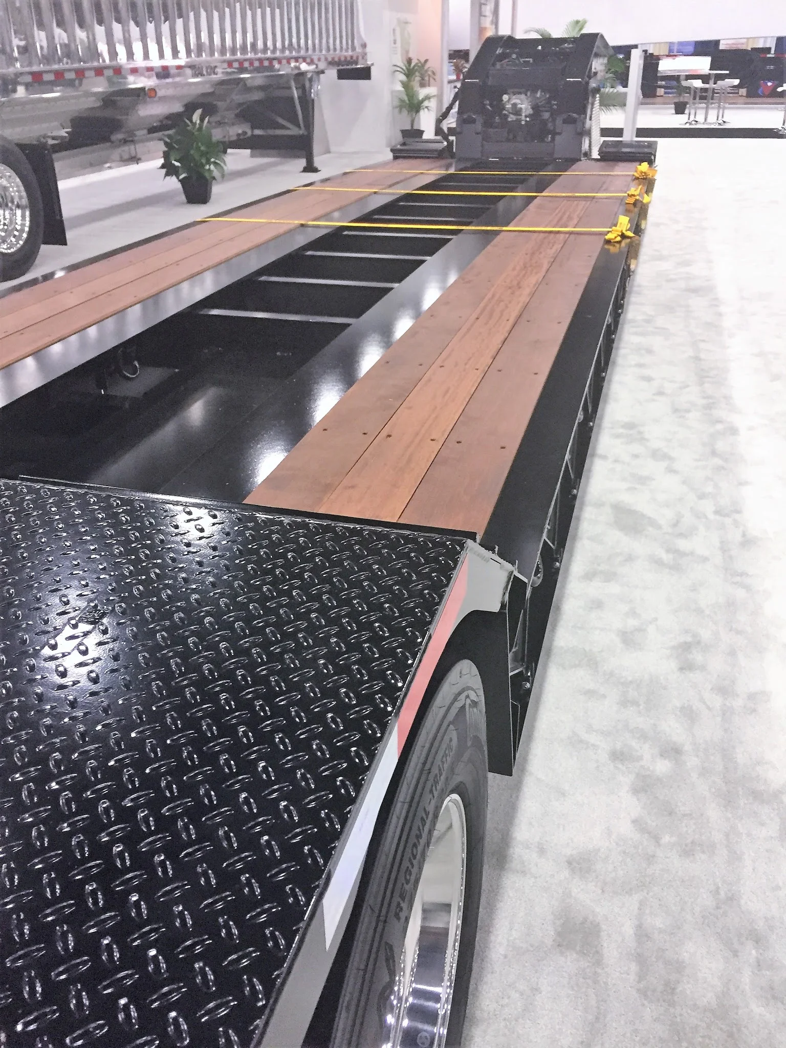 Freshly installed and oiled hardwood deck on a lowboy trailer