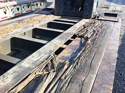 damaged, cracked hardwood trailer floor